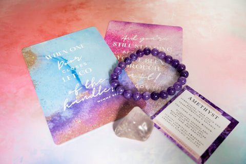 Amethyst bracelet with packaging and information card on a colorful background